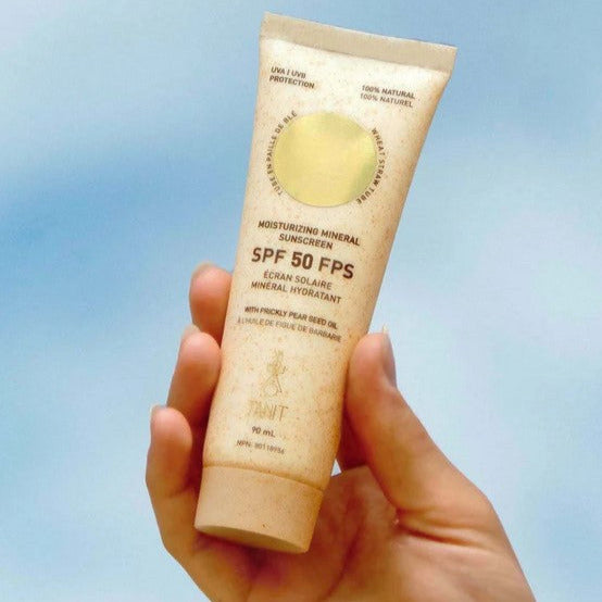 Moisturizing SPF 50 mineral sunscreen from Tanit Botanics in a 90 ml compostable tube is made in Canada with mineral filters, precious organic oils and natural butters to protect and moisturize the skin safely, without any harm to marine life