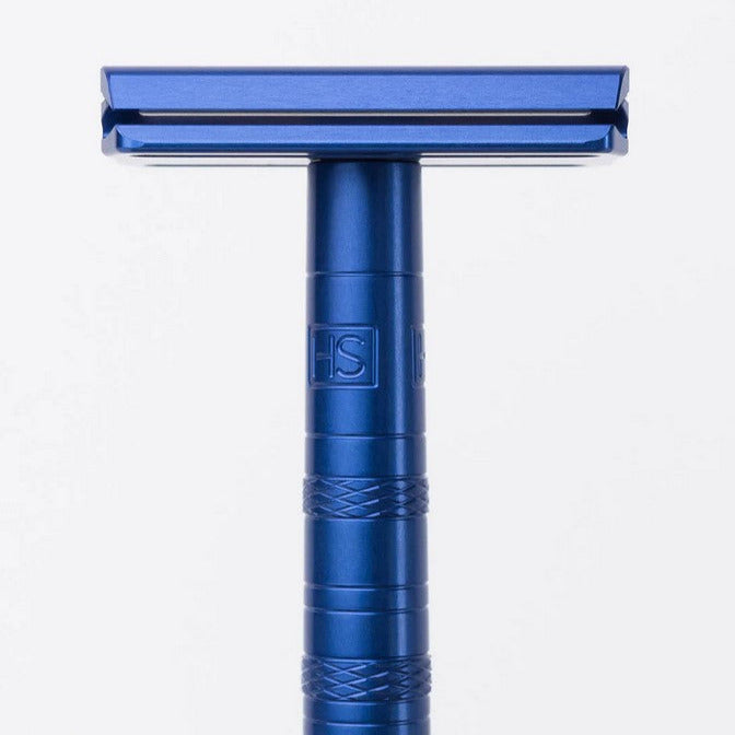 Close-up of Henson AL13 Steel Blue Razor handle with textured grip and engraved logo