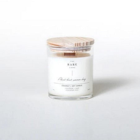 This lavender sage 'About that summer day' coconut and soy candle by The Bare Home with a wooden wick and a wooden lid is pictured on a white background.