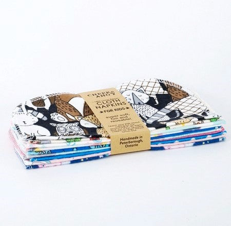 Set of 10 cloth napkins for kids by cheeks ahoy in mixed boys and girls patterns on a white background. This are super soft, fun and reusable and are handmade in Canada.