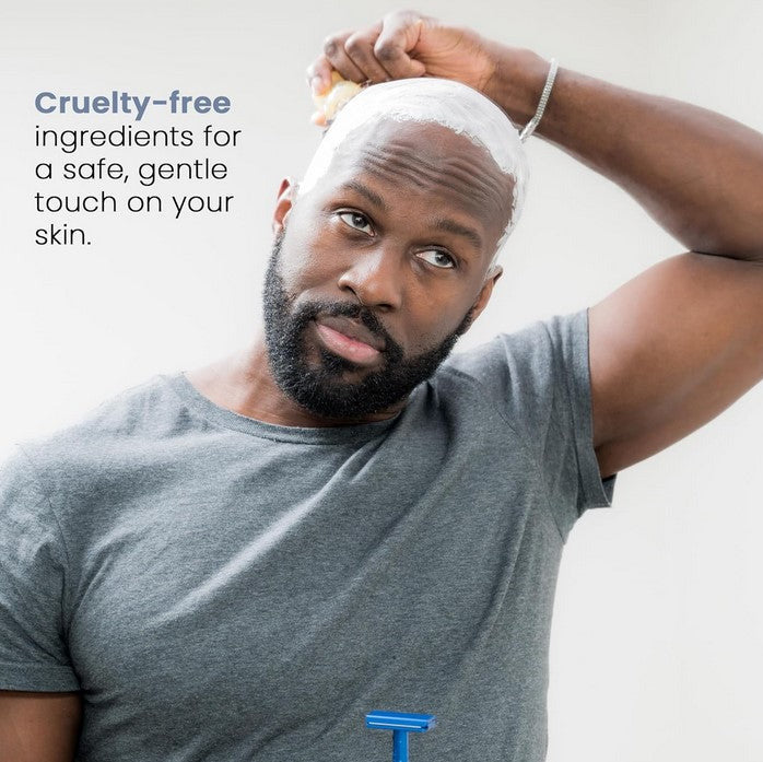 Man shaving head with Henson Shave Cream, featuring cruelty-free formula