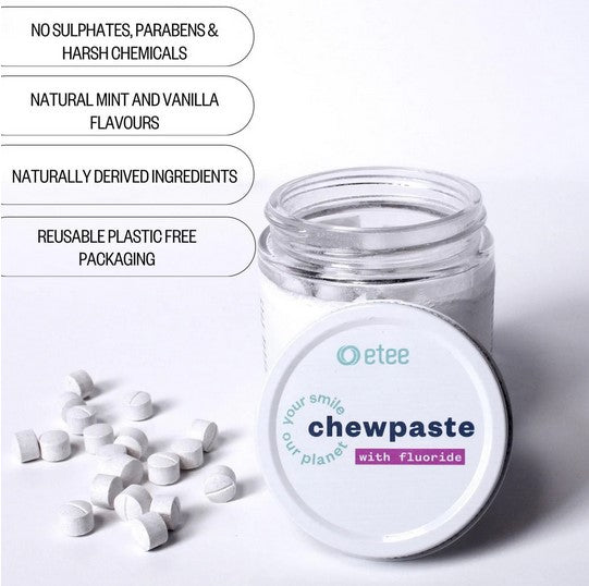 Open glass jar of etee fluoride chewpaste toothpaste tablets with lid and scattered tablets, highlighting zero-waste, plastic-free oral care