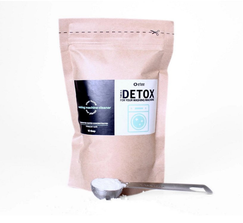 Etee Super Concentrated Washing Machine Cleaner in compostable paper pouch with scoop of powder – plastic-free, non-toxic, and biodegradable. Shown on a white background.