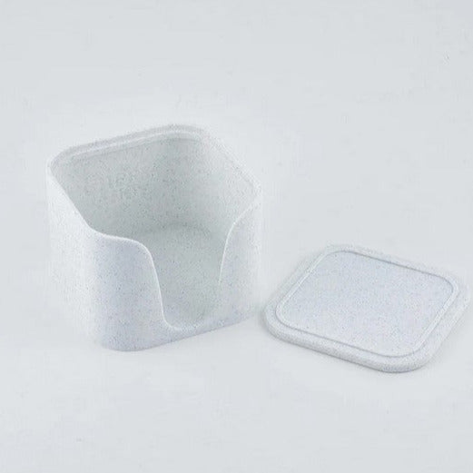 Open white granite facial rounds caddy made from plant-based material, lid beside base