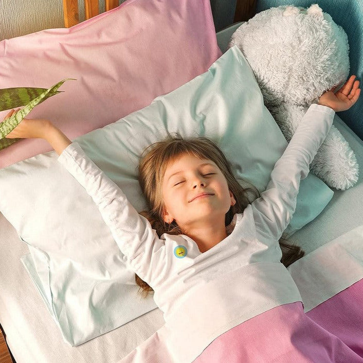 Child resting peacefully in bed wearing NATPAT Breathe Easy Sticker for overnight congestion relief