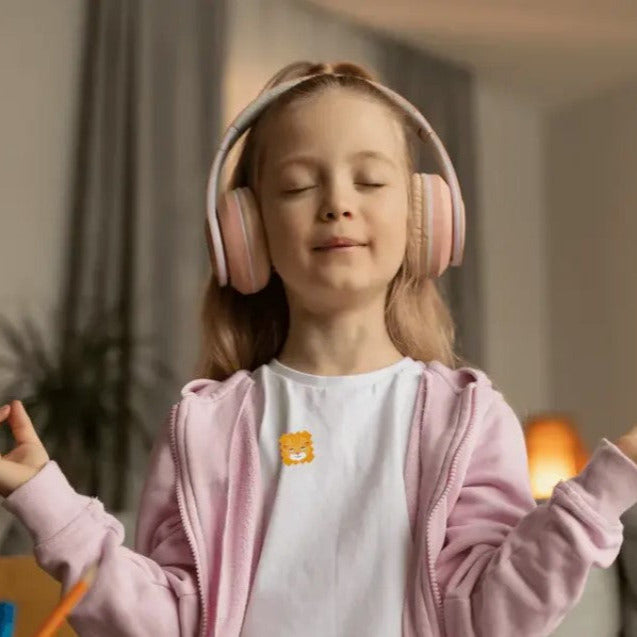 Child practicing mindfulness while wearing NATPAT ZenPatch calming sticker for relaxation and focus