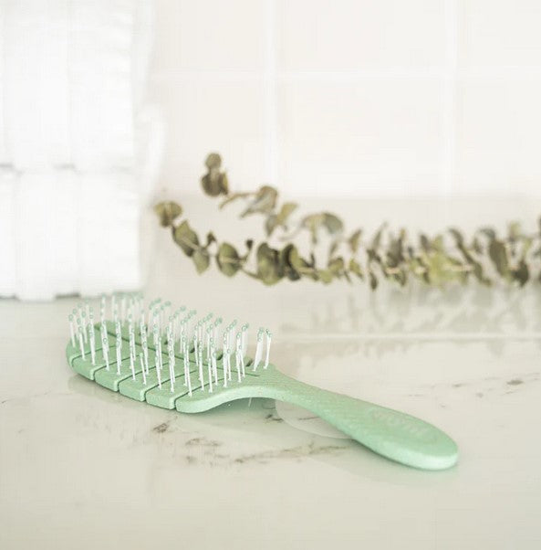 Green Myni Wheat Straw Hair Brush is perfect to use in the shower if you want to brush your hair while conditioning it.