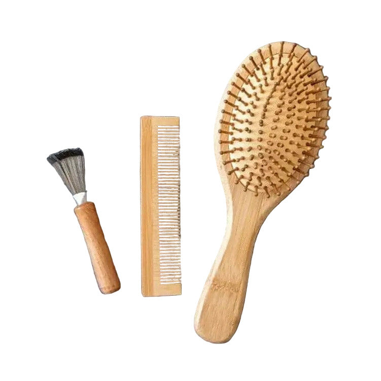 Eco-friendly Bamboo Hair Brush Set by Plantish featuring brush, comb, and cleaner on grey surface – zero-waste natural hair care essentials.