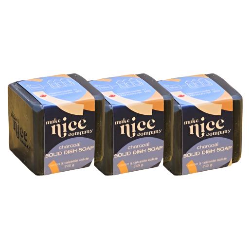 Three labelled unscented charcoal solid dish soap cubes weighing 240 g each sit side by side on a white background. This zero waste dish soap is made in Canada by the Make Nice Company