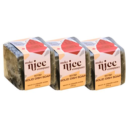 Three labelled unscented scrap solid dish soap cubes weighing 240 g each sit side by side on a white background. This zero waste dish soap is made in Canada by the Make Nice Company is made of white and charcoal dish soap bar scraps