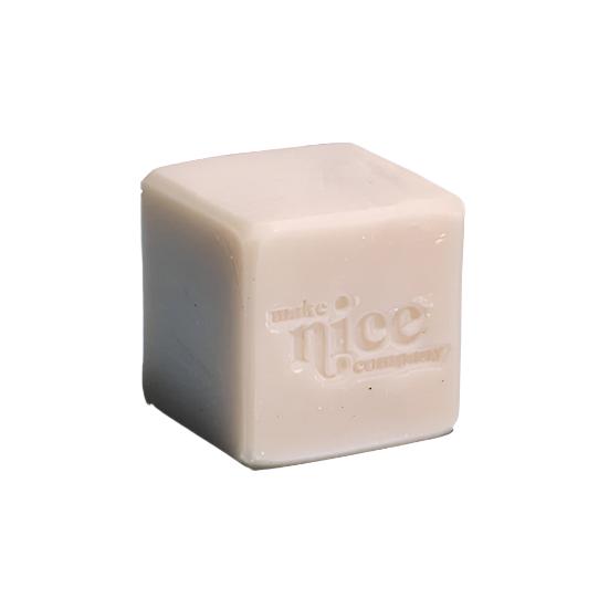 An unlabelled mint and eucalyptus scented solid dish soap cube 240 g made in Canada by the Make Nice Company with essential oils on a white background