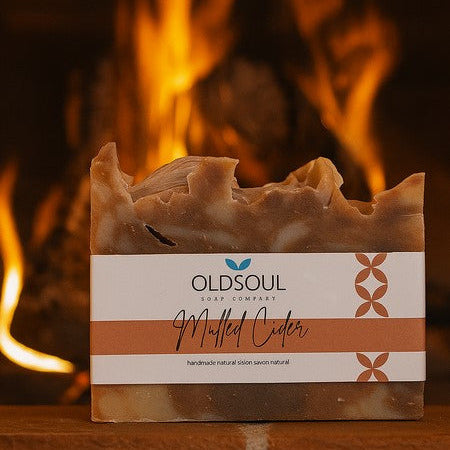 Mulled Cider artisan soap by Old Soul Soap Company with warm spicy scent, photographed in front of a cozy winter fireplace