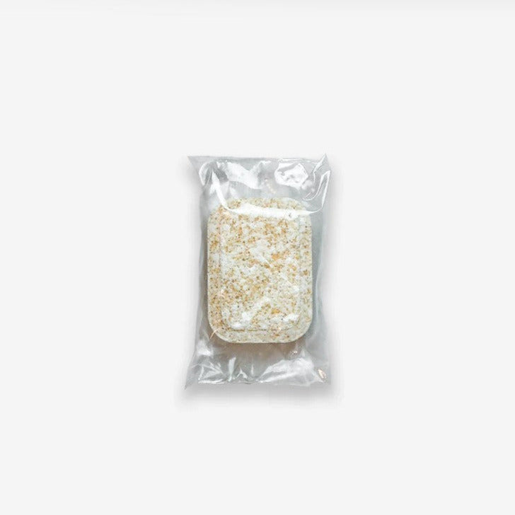 Individual fresh lemon dishwasher detergent tablet in biodegradable packaging. The tablet is available in sets of 4 or 10 individual tablets. Please note the tablets in the bags of 50 have no PVA wrap.