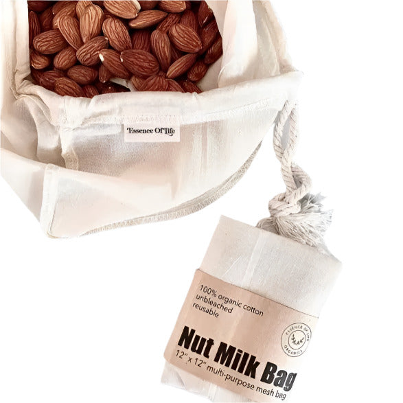 Reusable organic cotton nut milk bag filled with almonds on a white background. The unbleached, multi-purpose mesh bag is labeled 'Essence of Life' and packaged with a kraft paper wrap.