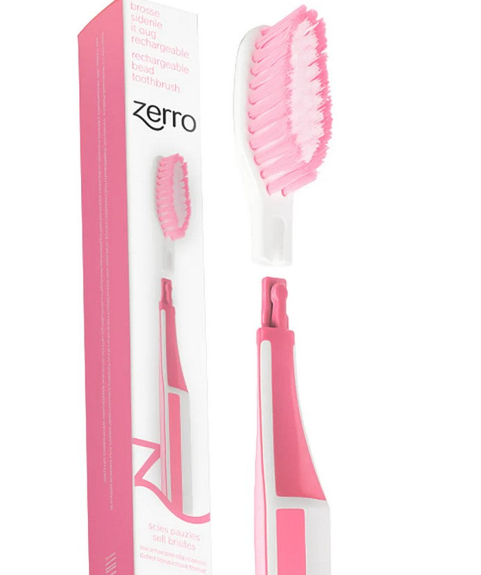 Zerro Replaceable Head Toothbrush in pink with soft bristles and reusable handle, Canadian-made eco-friendly toothbrush shown with packaging and snap-on replacement head.