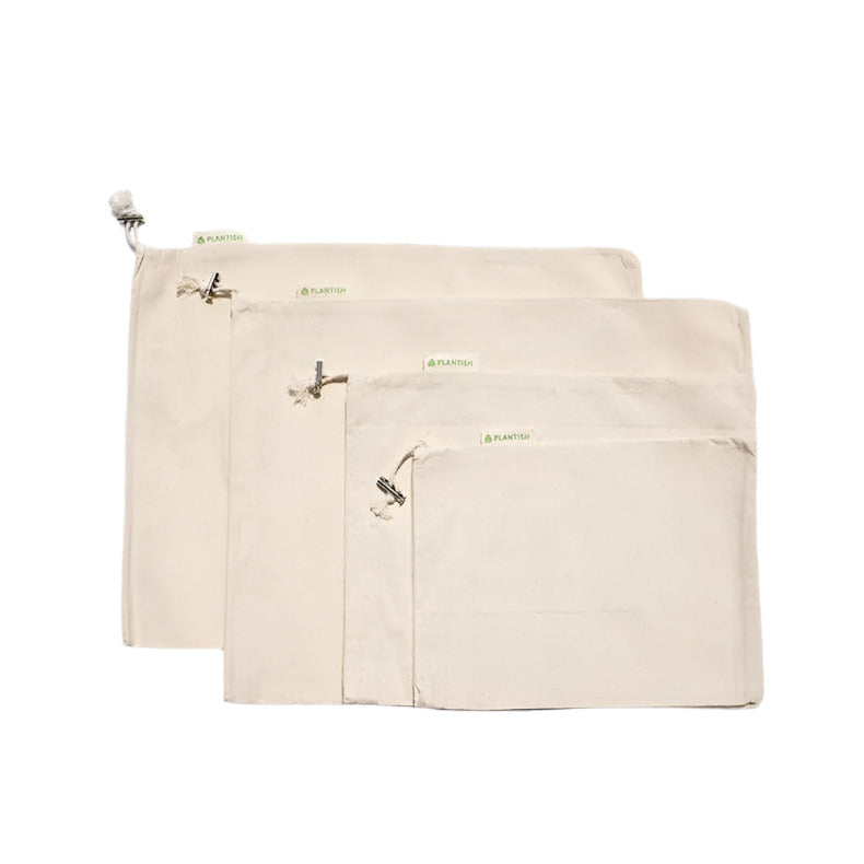 Two natural reusable bags with metal clips on a white background
