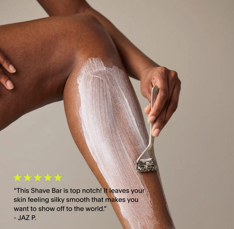 Woman shaving leg with Leaf razor and shave soap bar – top-rated customer review highlights silky smooth skin and luxurious lather