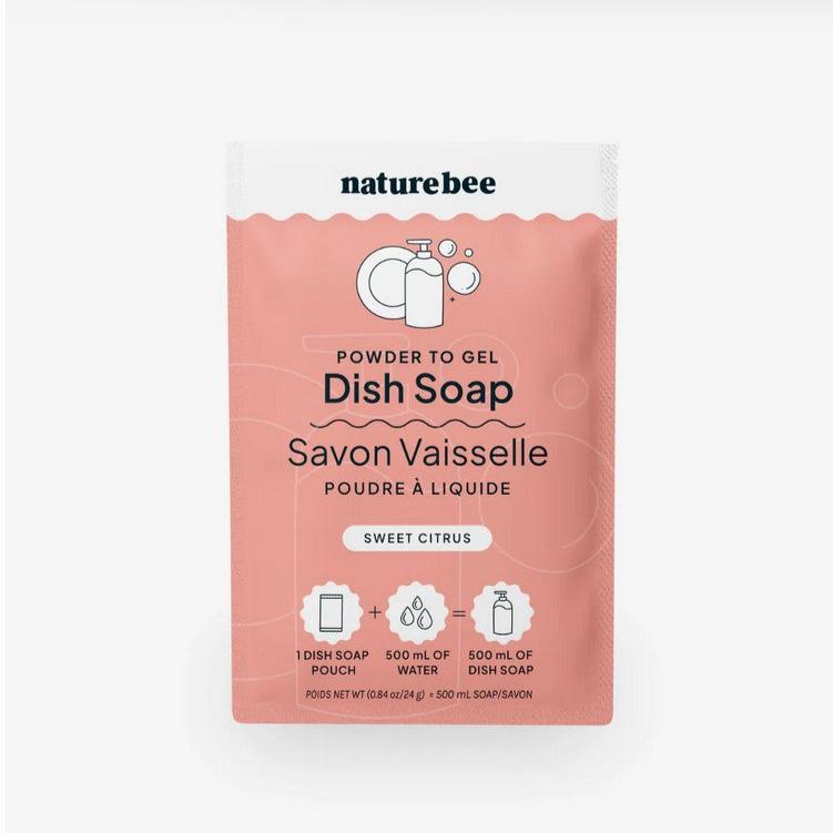 A packet of sweet citrus nature bee powder to gel dish soap on a white background. This single dish soap pouch when added to 500 ml of water makes 500 m of dish soap.