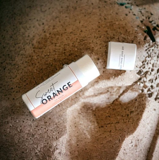 This Sweet Orange Lip Balm by the Old Soul Soap Company is Canadian made and naturally flavoured. It features a long lasting blend of oils and butters infused with calendula and chamomile in a push up cardboard tube.