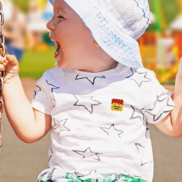 Toddler outdoors wearing NATPAT AllergyPatch essential oil allergy relief sticker for safe seasonal comfort.