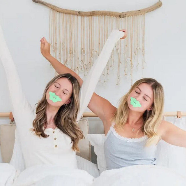 Two women waking up refreshed after using Mintier Mouth Tape for deeper, restorative sleep