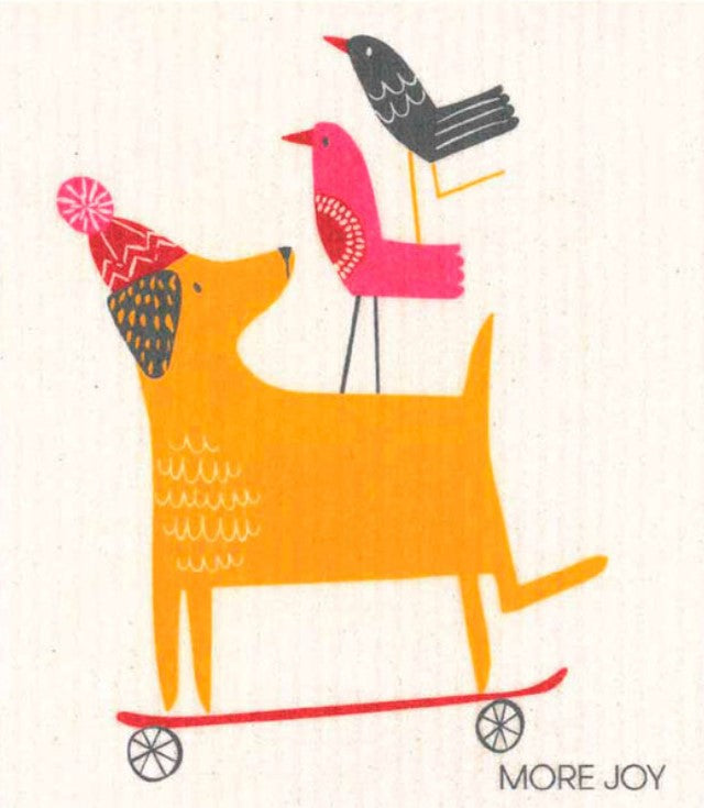 Compostable eco sponge cloth made of cellulose and featuring a brightly-coloured cartoon dog wearing a toque while riding a skateboard replaces paper towel by absorbing 20x its weight in liquid. Size 20 x 17 cm