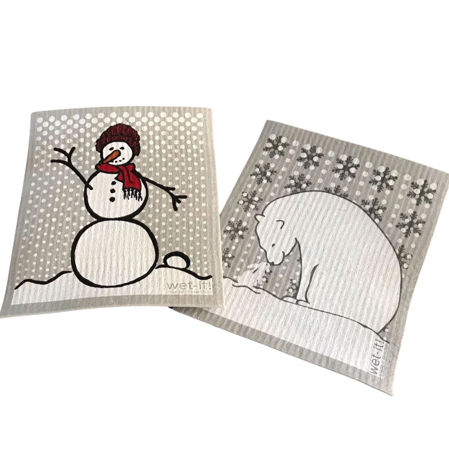 Introducing our charming Winter Wet It! Cloths, a delightful set of two that serves as your perfect companion for household chores and an enchanting holiday gift option. This duo features a snowman with a red hat and scarf on one Swedish cloth and a polar bear with a bunny on the second, both set against a stylish grey background.