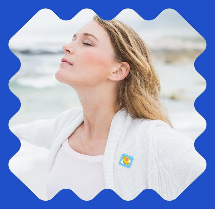 Woman breathing deeply outdoors wearing NATPAT StuffyPatch Breathe Easy Sticker for soothing vapor relief