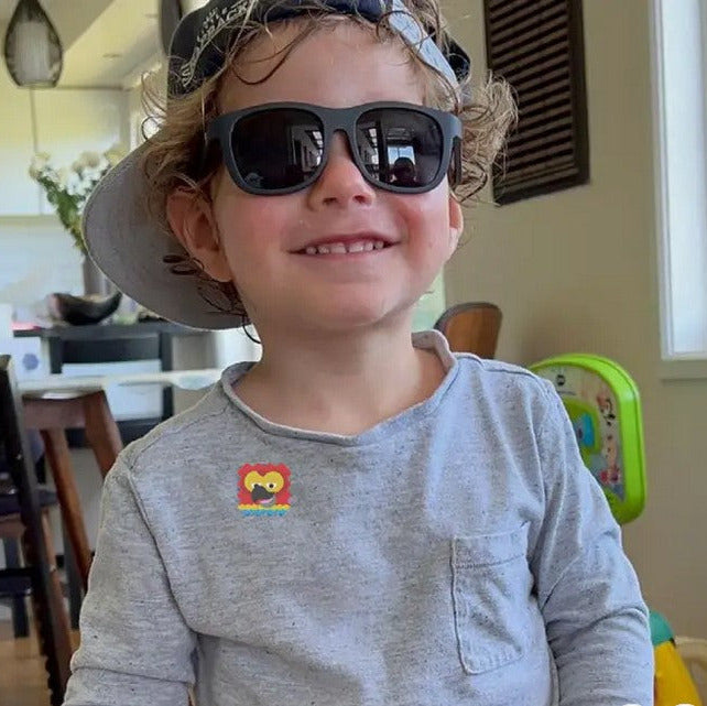 Smiling boy wearing NATPAT AllergyPatch seasonal allergy relief sticker for natural, mess-free breathing support.