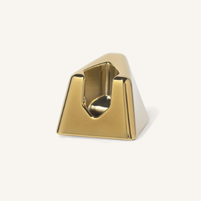 Matching metal stand for a gold Leaf Razor