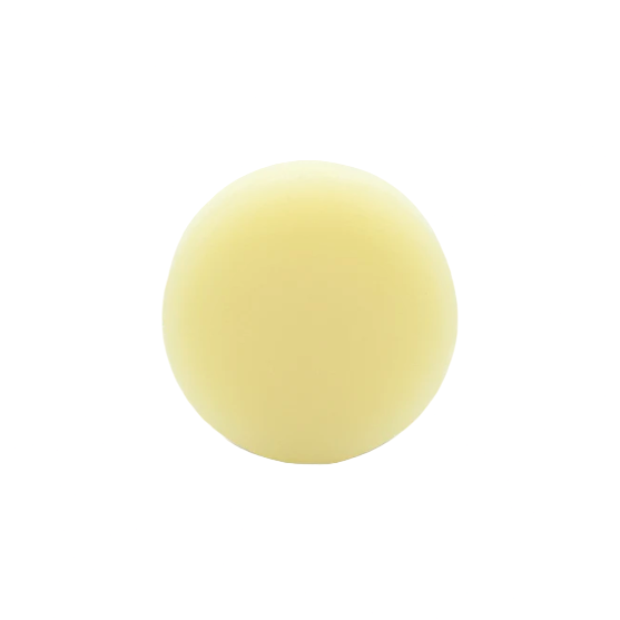 Unpackaged orange patchouli scented conditioner bar for dry curly hair made in Canada by good juju