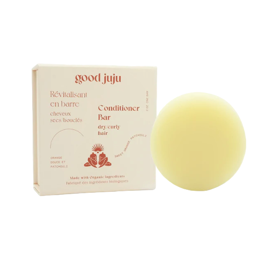 Orange and patchouli scented conditioner bar for dry curly hair in a zero waste box made in Canada by good juju