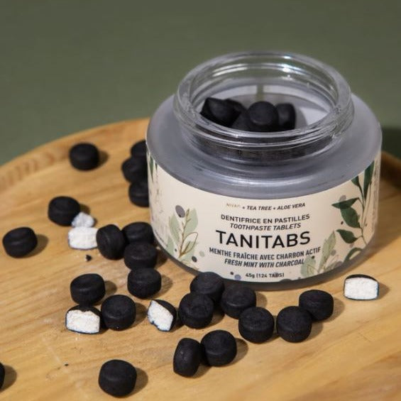 Fresh mint activated charcoal toothpaste tablets in a 45 g glass jar (124 tablets) made in Canada by Tanit
