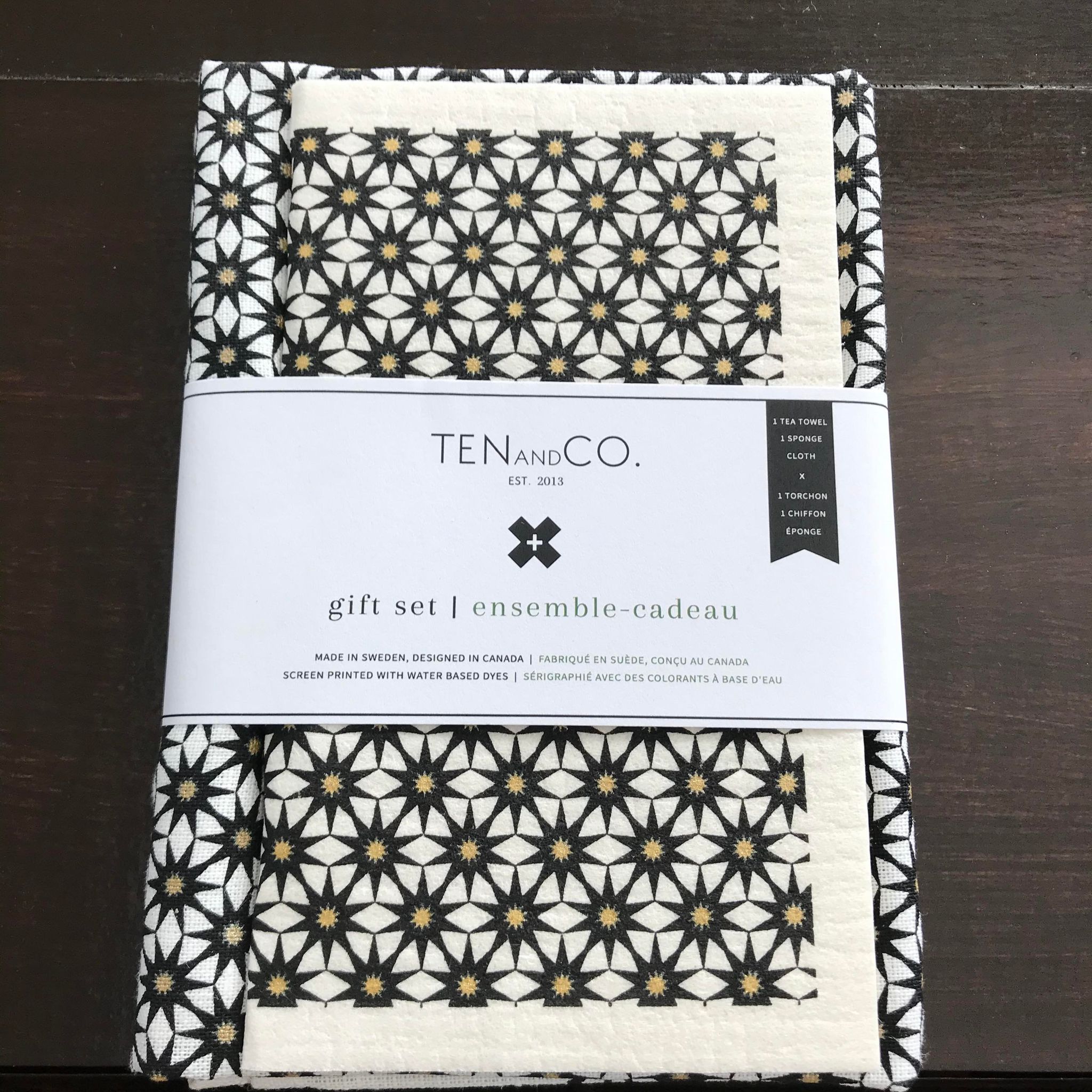 Starburst Gold and Black pattern on white absorbent Swedish sponge cloth and tea towel gift set designed in Canada by Ten and Co.