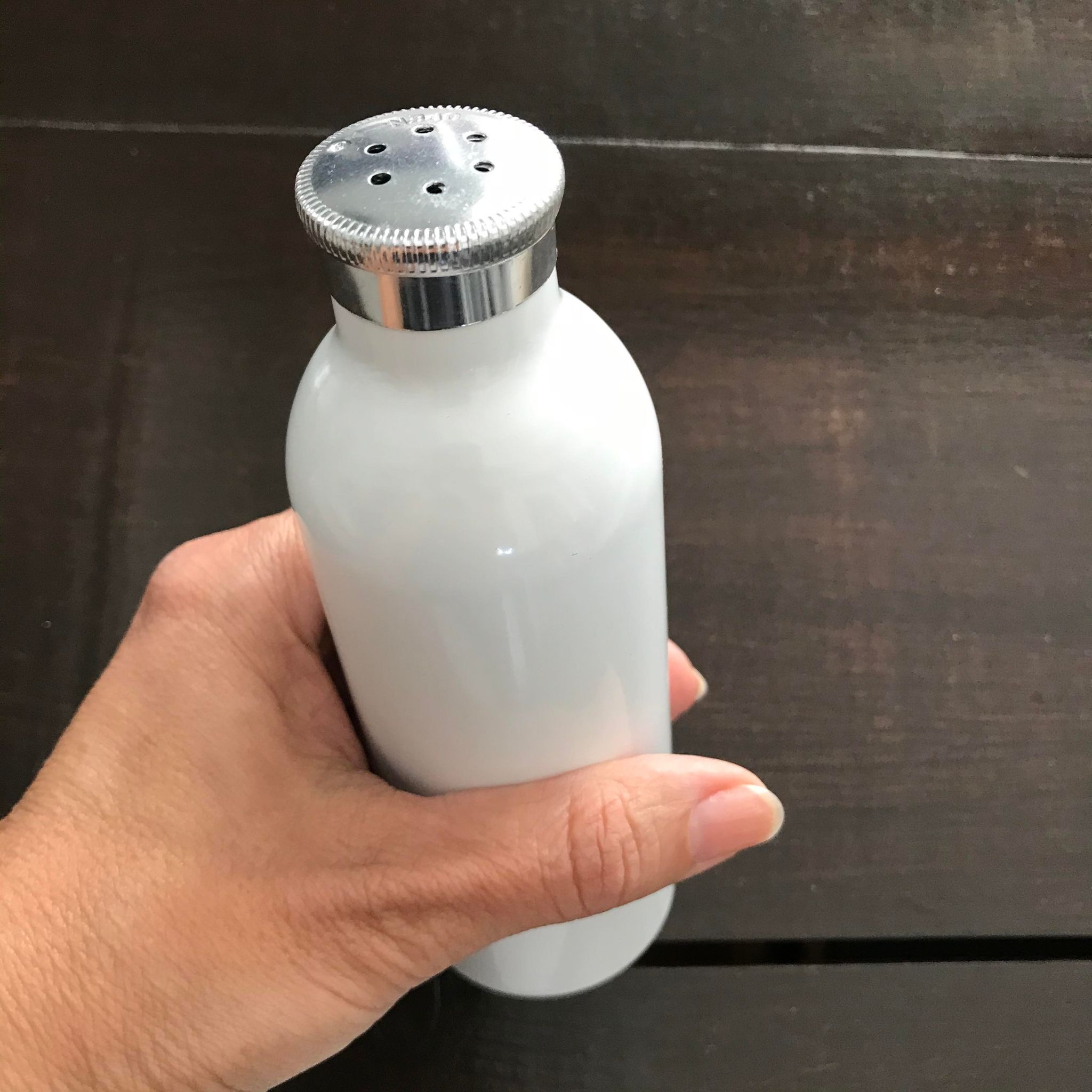 White aluminum shaker bottle sold separately for dispensing dry shampoo powder