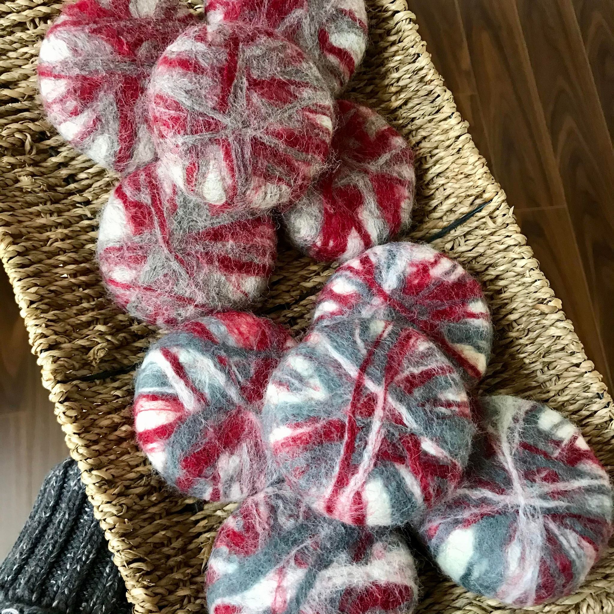 Round natural rosemary mint and lavender chamomile soaps made in Canada by Simply Natural Canada and hand felted in shades of grey, red and white