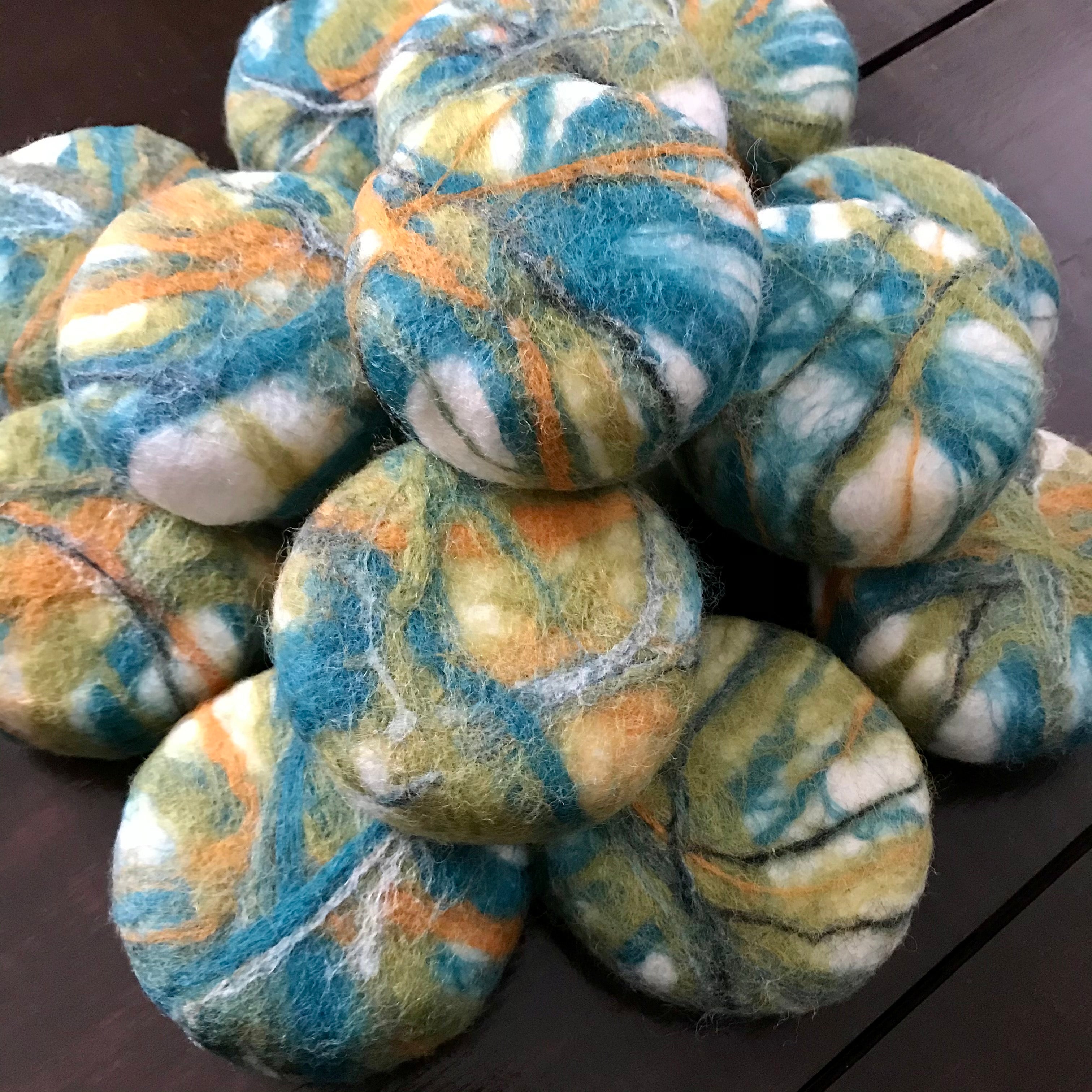 stack of hand felted vegan cedar sage soap in earth tones made in canada by simply natural canada