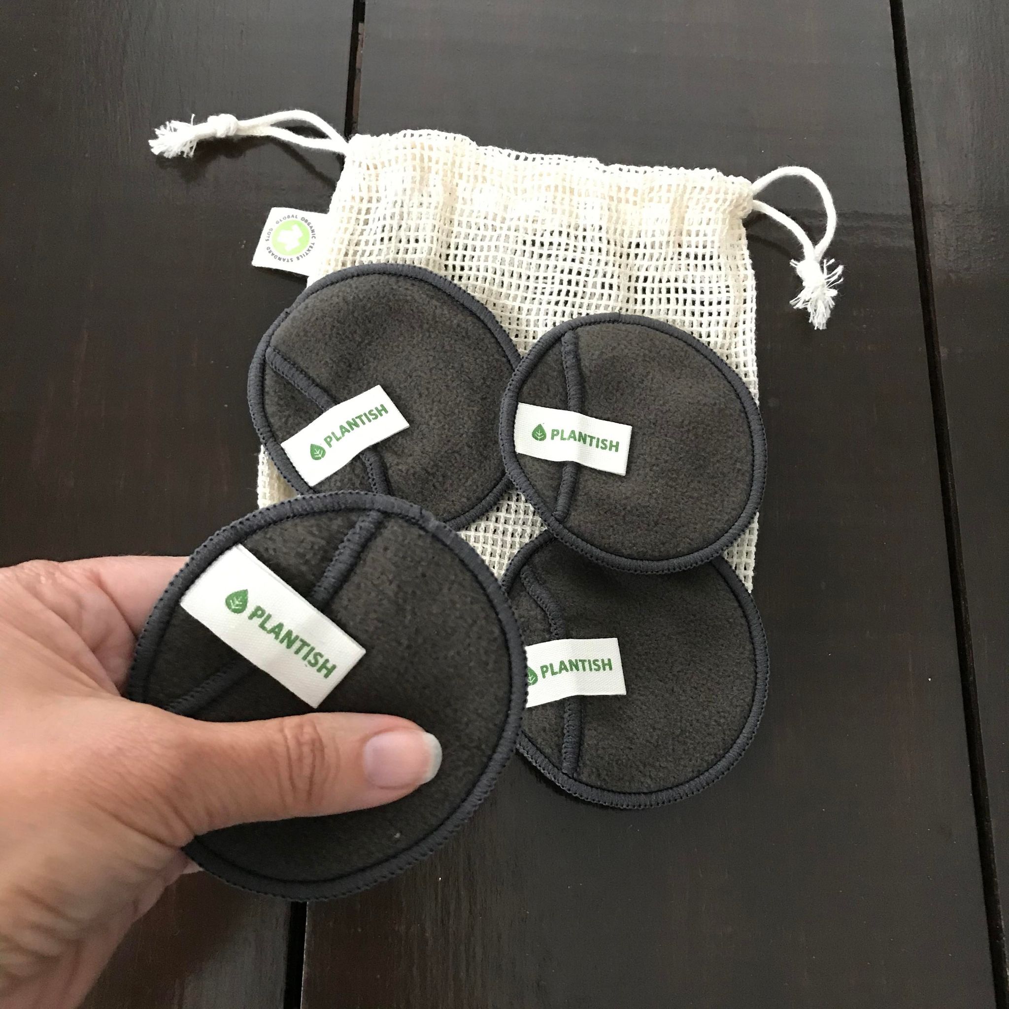Plantish bamboo charcoal reusable cotton facial pads by Plantish in an mesh organic cotton bag for laundering