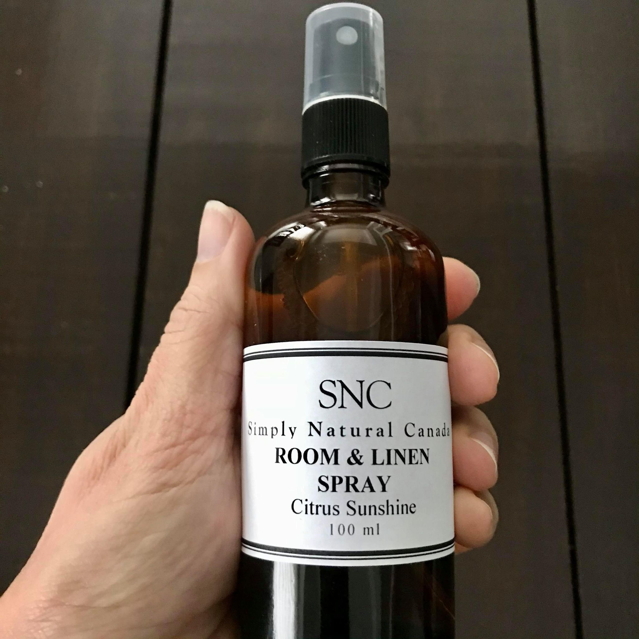 natural citrus sunshine essential oil room and linen in a 100 ml amber glass bottle with black spray top made in canada by simply natural canada