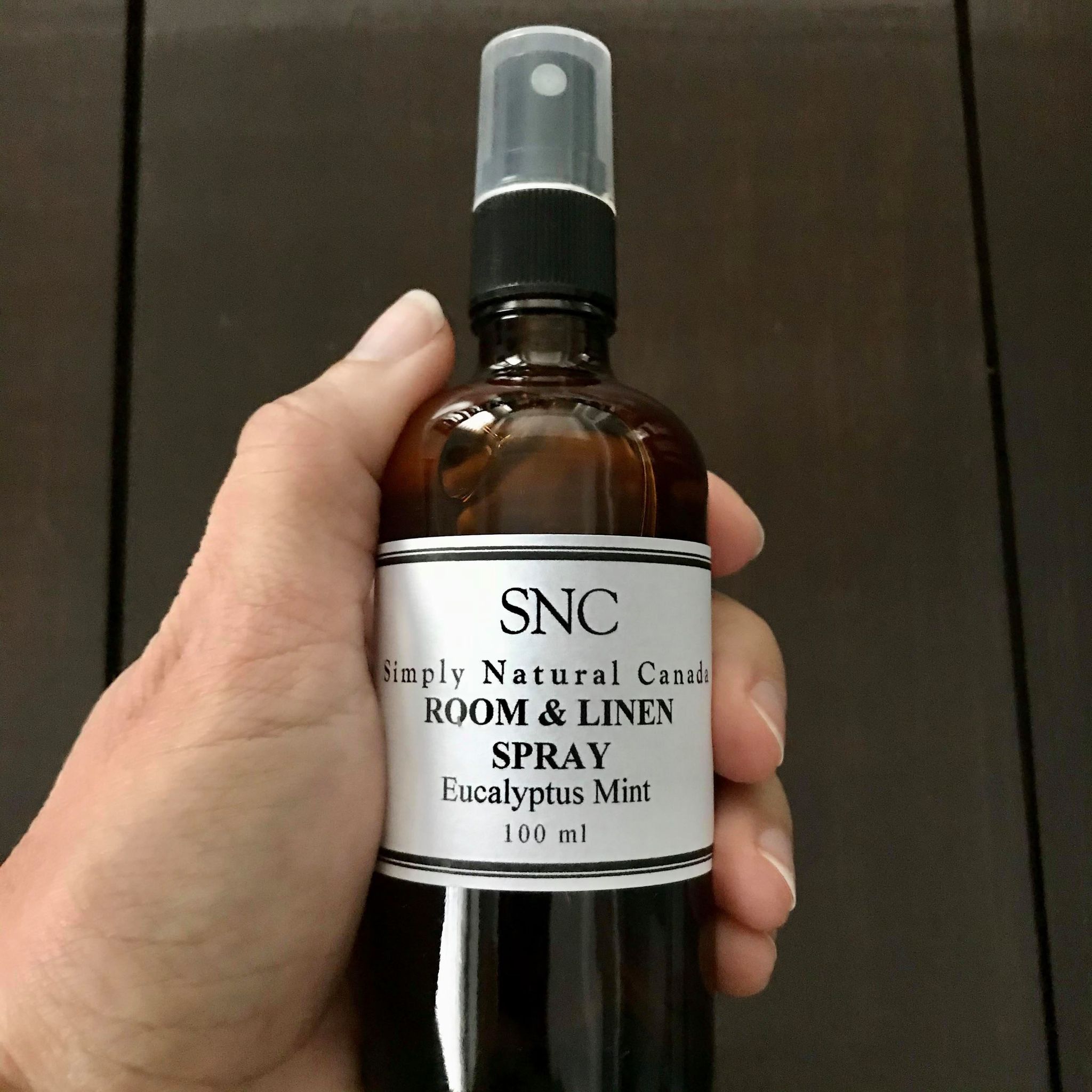 natural eucalyptus mint essential oil room and linen in a 100 ml amber glass bottle with black spray top made in canada by simply natural canada