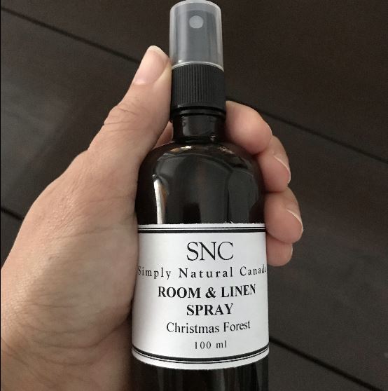 natural christmas forest essential oil blend room and linen in a 100 ml amber glass bottle with black spray top made in canada by simply natural canada