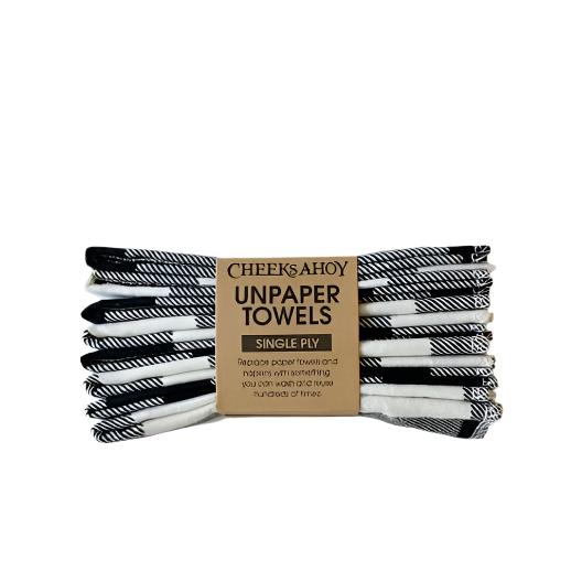 Close-up of Cheeks Ahoy Swedish dishcloths showcasing white and black plaid woven fabric texture and stitched edges.