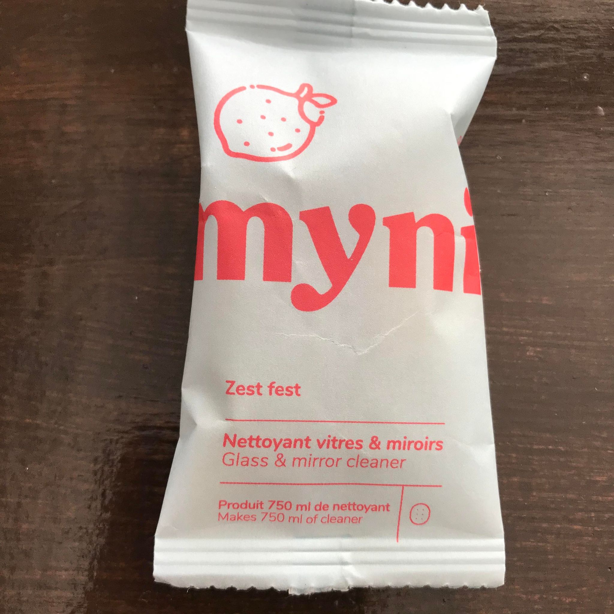 Zest Fest lemon mint scented glass and mirror cleaner cleaning tablet concentrate in a compostable pouch made in canada by myni