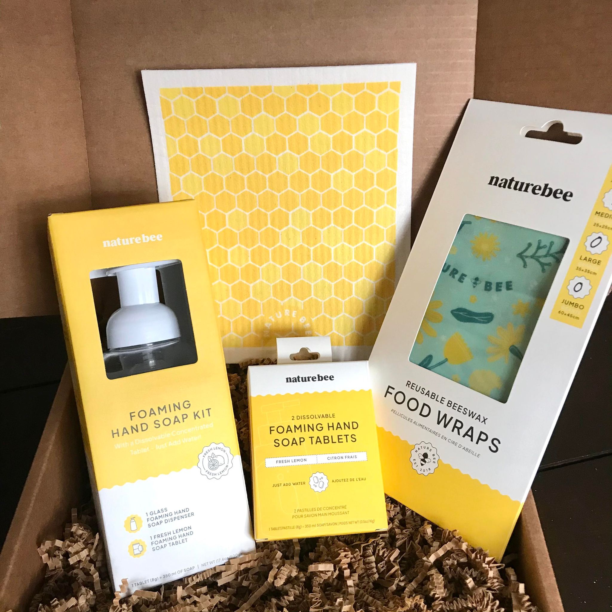 Included in this zero waste kitchen set is Swedish sponge cloth in a honeycomb pattern, a fresh lemon foaming hand soap kit, a set of two fresh lemon foaming hand soap tablets and a large green 'bee lovers' beeswax wrap.