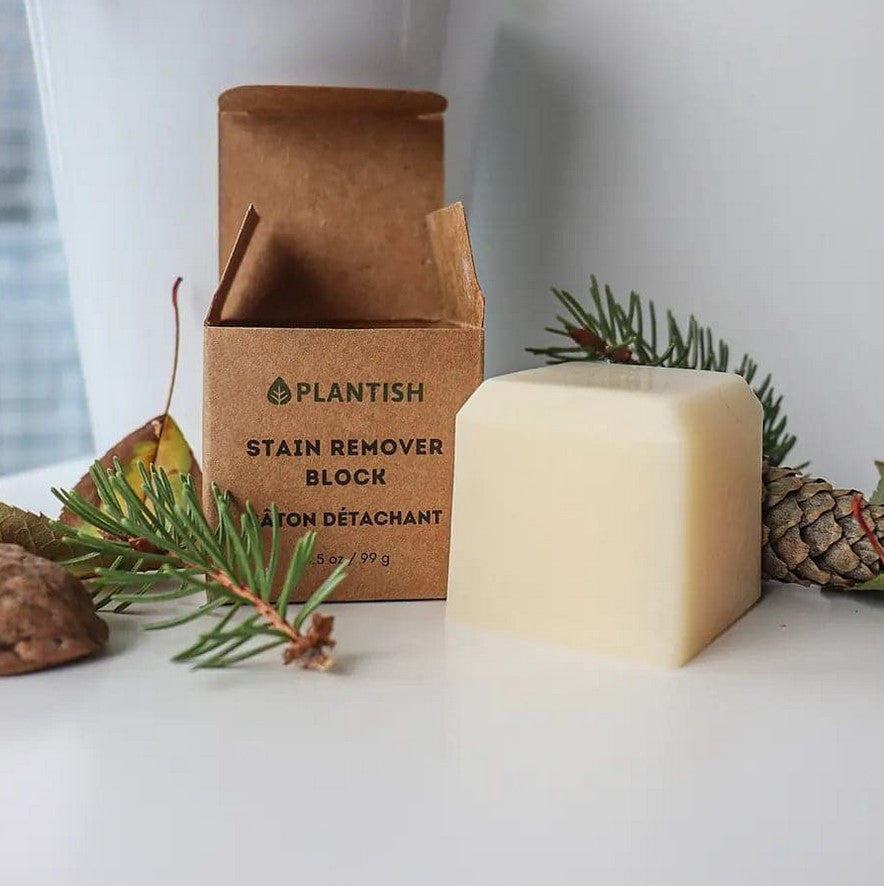 Plantish Stain Remover Block 3.5 oz displayed with eco-friendly kraft packaging and pine accents – sustainable, plastic-free Canadian stain remover soap.