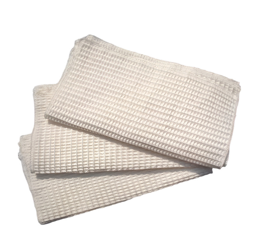 Stack of 3 sets of 3 textured ivory bamboo cloths on a white background.