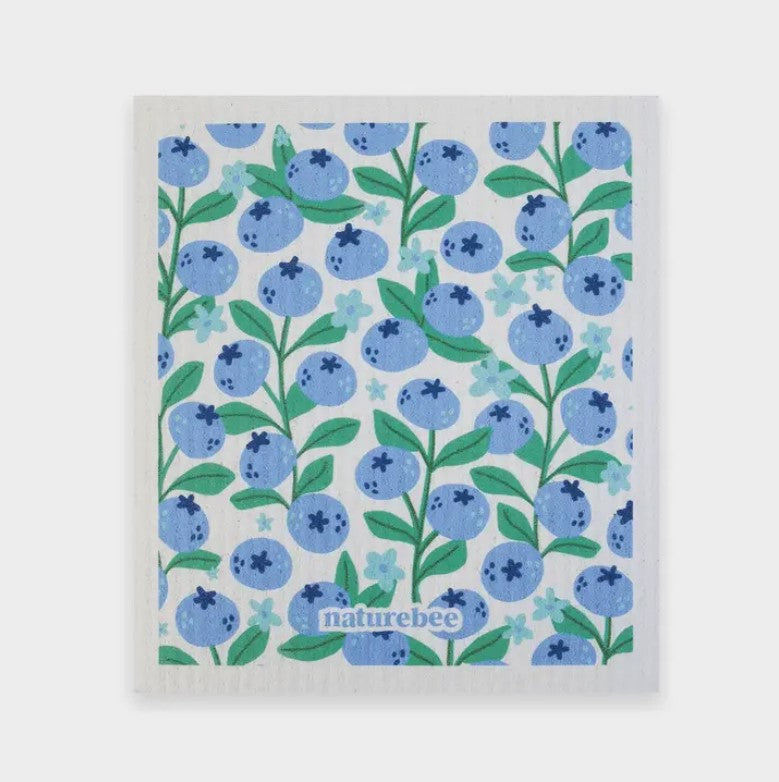 Swedish dishcloth in a pattern of blueberries on a white background by Nature Bee replaces 17 paper towel rolls and absorbs up to 20x its weight in liquid