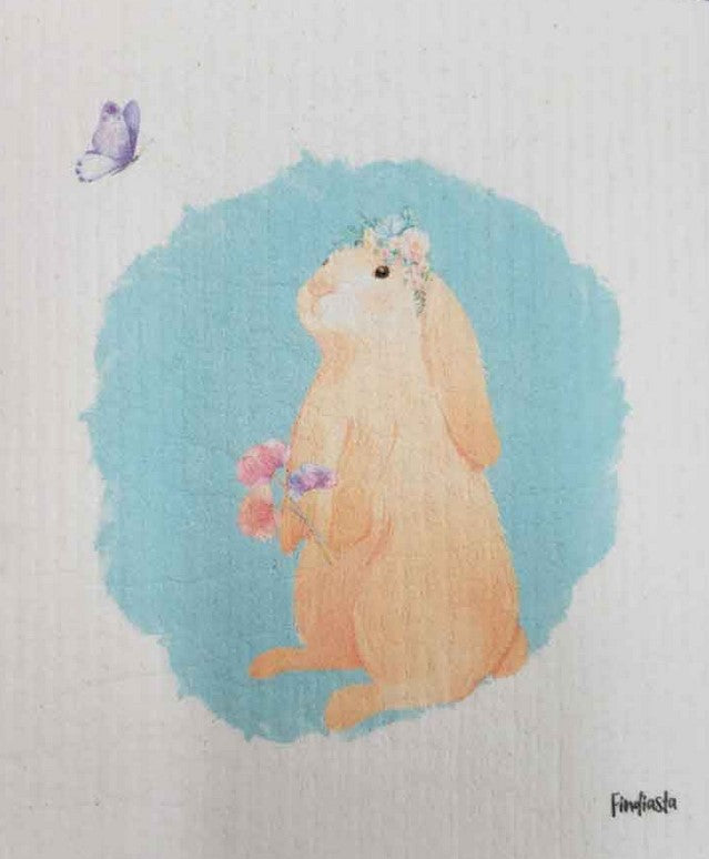 Compostable eco sponge cloth made of cellulose and featuring the enchanting rendering of a bunny with flowers and a butterfly, replaces paper towel by absorbing 20x its weight in liquid. Size 20 x 17 cm