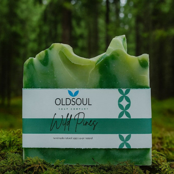 Wild Pines artisan bar soap by Old Soul Soap Company with forest backdrop – Canadian-made natural handcrafted soap with pine, eucalyptus, and peppermint