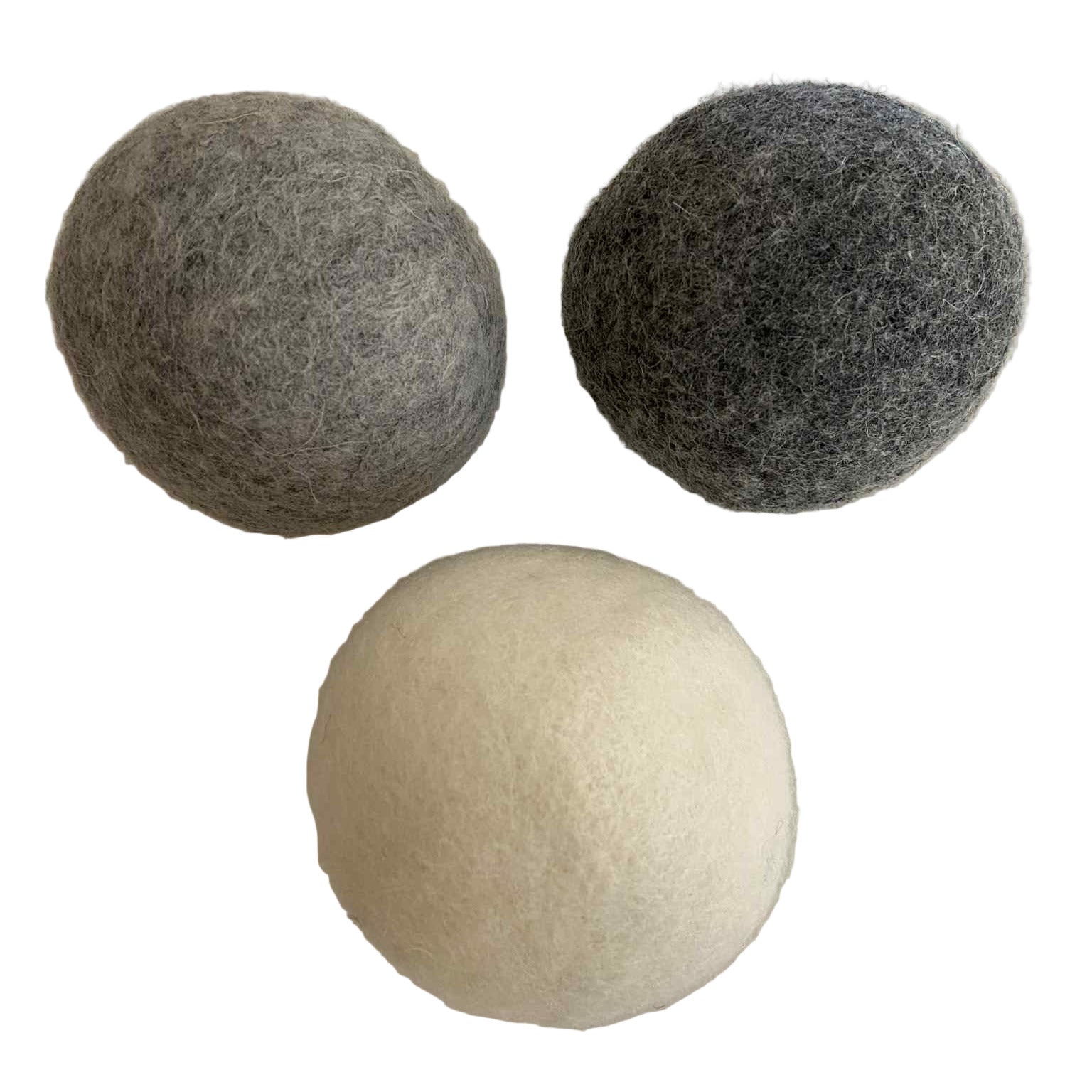 Earthly Change large wool dryer balls in grey, charcoal, and natural white on marble background – eco-friendly reusable fabric softener alternative